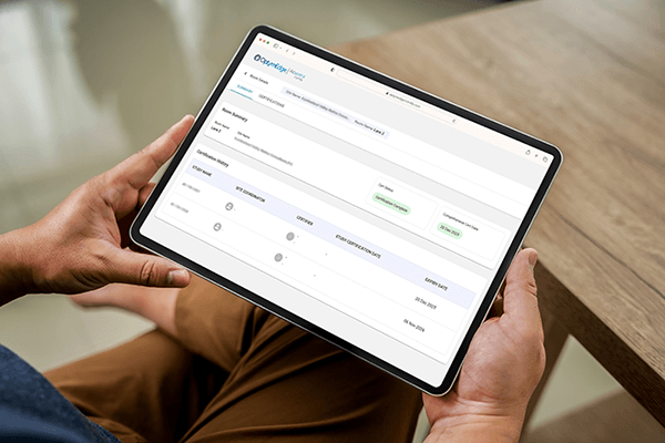 Reviewing certification dashboards on a tablet